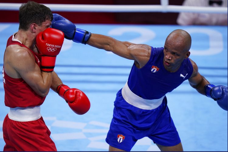 Throwback champ Iglesias wins his 2nd boxing gold for Cuba